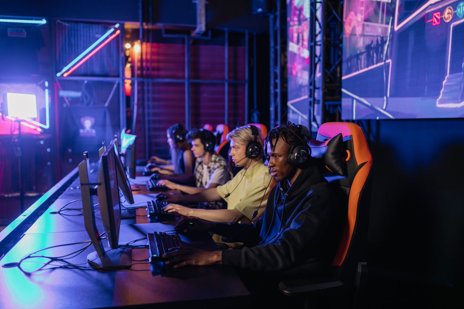 Teammates playing side by side at the LAN center